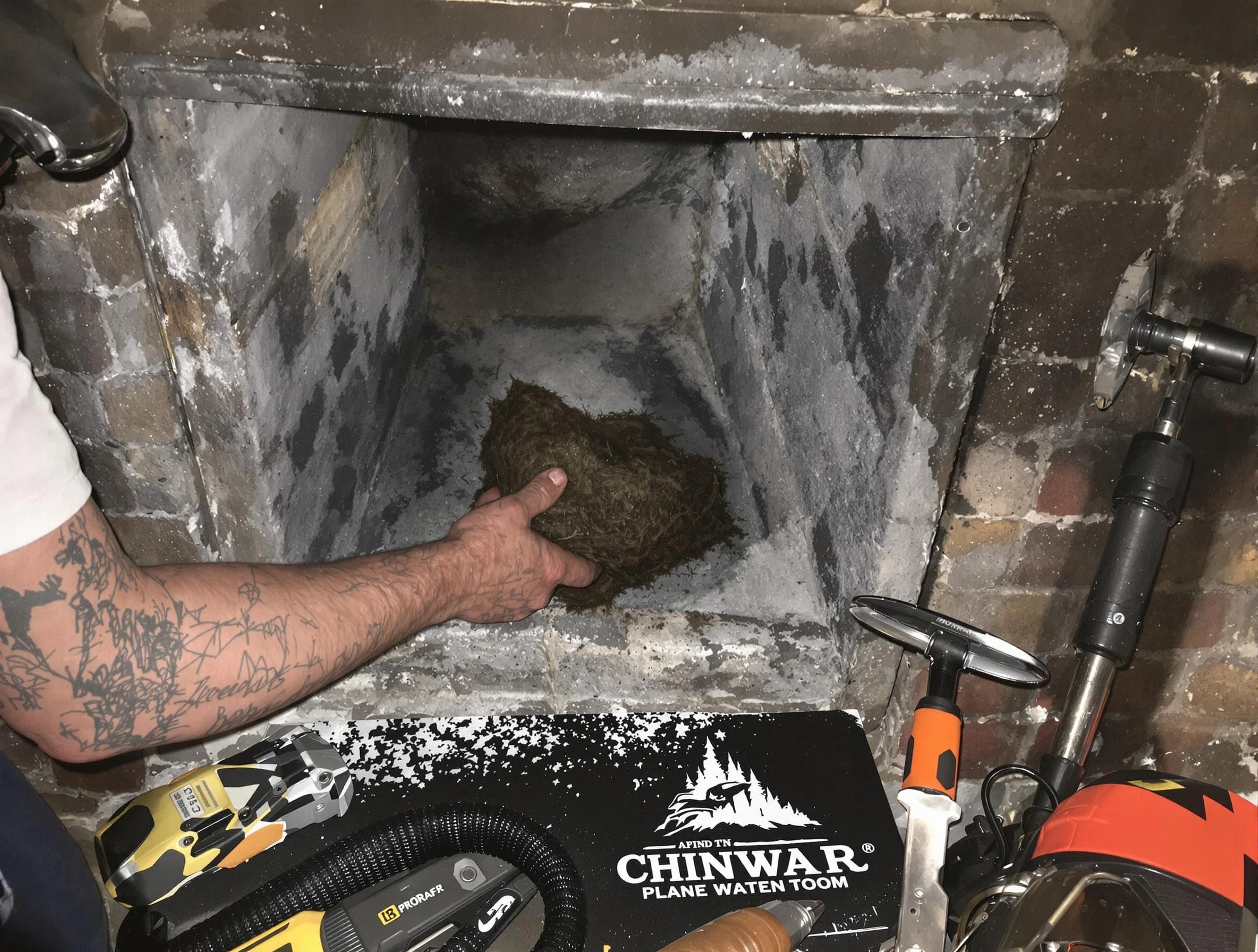 Murray Chimney Sweep safely removing debris and screening chimney in Murray, UT